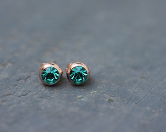 Rose gold stud earrings made of stainless steel with cut glass stone in turquoise green rose gold earrings