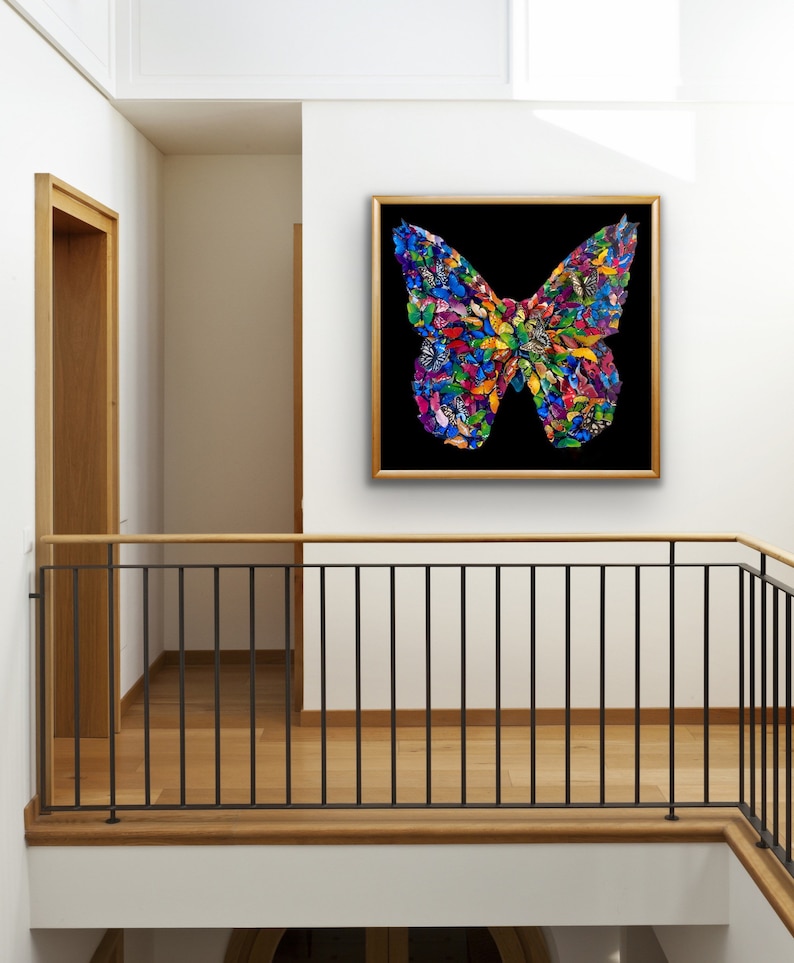 May include: A framed artwork featuring a colorful butterfly made of smaller butterflies. The butterfly is set against a black background and is framed in a gold frame.