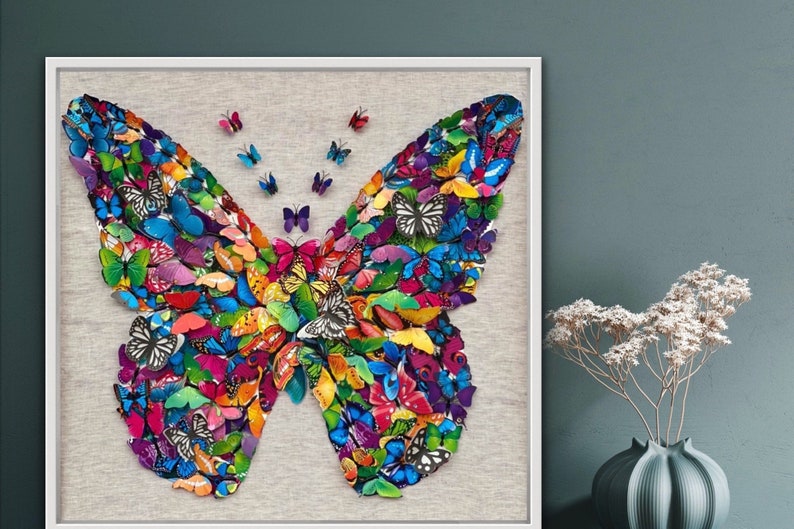 May include: A framed artwork featuring a large butterfly made of many smaller butterflies in various colors, including blue, green, yellow, orange, red, and purple. The butterflies are arranged in a symmetrical pattern, creating a vibrant and colorful design.