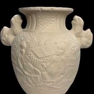 May include: Off-white ceramic vase with two lion-shaped handles. The vase features detailed relief carvings of figures, foliage, and geometric patterns. The vase has a wide mouth and a rounded body, perfect for home decor.