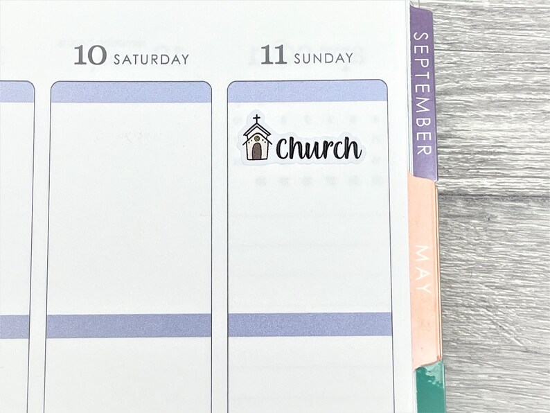 May include: A white planner page with the words "10 Saturday" and "11 Sunday" at the top. A sticker with a small church drawing and the word "church" is placed on the Sunday page.