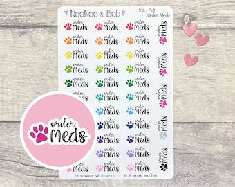 May include: A sheet of colorful paw print stickers with the text "order meds" on each sticker. The stickers are arranged in rows and columns on a white background. There are three pink hearts in the upper right corner of the image.