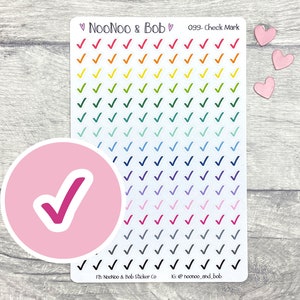 May include: A sheet of rainbow-coloured check mark stickers, with a pink circle sticker featuring a magenta check mark. The sheet has the text "NooNoo & Bob" and "099-Check Mark".