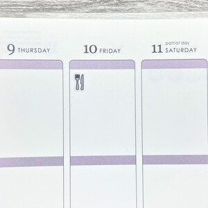 May include: A close-up of a weekly planner with a sticker of a fork and knife on the Friday page. The planner has a light purple stripe across the top of each day.