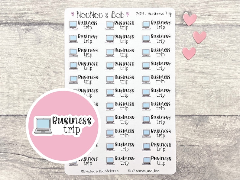 May include: A sheet of 30 stickers featuring a laptop computer icon and the text "Business Trip". The stickers are on a light wood background with three pink hearts.
