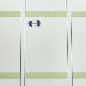 May include: A purple dumbbell sticker on a white background with green stripes.