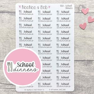 May include: A sheet of stickers with a pink circle in the center. The circle has a white outline and the text "School dinners" with a fork and knife graphic. The rest of the sheet has 27 stickers with the text "School dinners" and a fork and knife graphic. The stickers are on a light wood background.