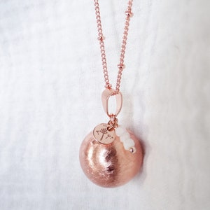 Rose gold pregnancy bola, dandelion flower, moonstone, rose quartz. Lithotherapy pearl
