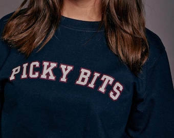 Sudadera navideña con el eslogan de Picky Bits Varsity