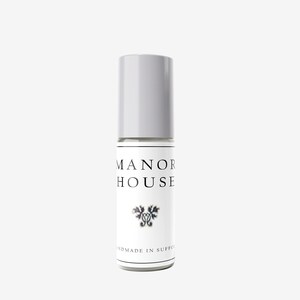 May include: A white roll-on bottle with a grey cap. The bottle has the text "MANOR HOUSE" and "HANDMADE IN SUFFOLK" printed on it.