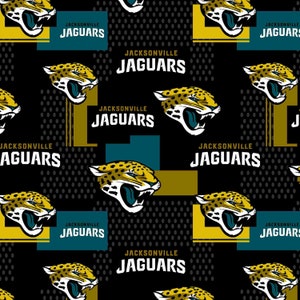 May include: A black and gold fabric with a repeating pattern of a teal and gold jaguar head with the text "JACKSONVILLE JAGUARS" repeated throughout.