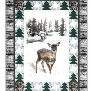 May include: A Fawn quilt pattern featuring a central panel of a deer in a snowy forest. The border includes pieced dark green trees and white snowflake shapes, framed by a rustic gray wood-look edge. Text reads Fawn Quilt Pattern, CJC 5858-1, and Lap 54" by 72".