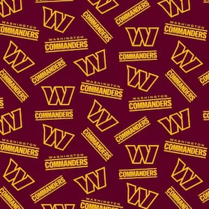 May include: A repeating pattern on a deep burgundy background featuring the gold Washington Commanders logo, which consists of a stylised letter W, alongside the text Washington Commanders printed in a bold, gold, sans-serif font.