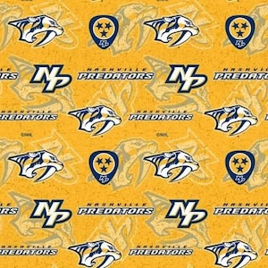 May include: A yellow and blue fabric with a repeating pattern of the Nashville Predators logo, including the team's mascot, a saber-toothed cat, and the words "Nashville Predators".
