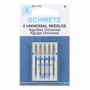 May include: A pack of five Schmetz universal sewing machine needles, labeled Art. 1710. The packaging features white and blue text on a blue textured background, with the needles visible in a clear plastic case showing size 90/14.