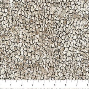 May include: A fabric pattern featuring a cracked, weathered texture in shades of beige, tan, and white, defined by a dark brown network of lines. A white ruler is visible at the bottom, showing measurements in inches from 1 to 8 inches.