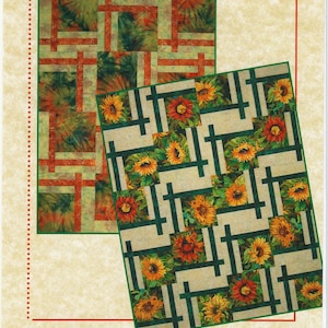 May include: A quilt pattern design with the title "BQ2" and the name "Maple Island Quilts". The pattern features two different designs, one with a green and orange tie-dye pattern and the other with a sunflower pattern on a cream background.
