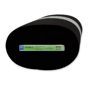 May include: A large roll of black fabric with a white stripe. A label with text and a barcode is attached to the fabric. The fabric appears to be a soft material, possibly fleece.