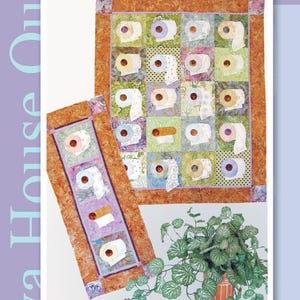 May include: Two wall hanging quilts titled We're On A Roll by Java House Quilts. The quilts feature a patchwork design with various toilet paper roll motifs in shades of green, orange, and purple, measuring 33 inches by 40 inches and 15 inches by 35 inches.