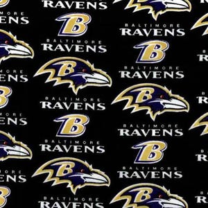 May include: A black fabric featuring a repeating pattern of the Baltimore Ravens logo, which consists of a purple and black raven head with a gold and white outline, alongside the text Baltimore Ravens in white capital letters.