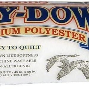 May include: A roll of white Poly-Down premium polyester batting in clear plastic packaging. The label features the text Poly-Down, Premium Polyester, Easy to Quilt, and Crib Size 45 in. x 60 in. (114.3 x 152.4 cm) with two flying geese illustrations.