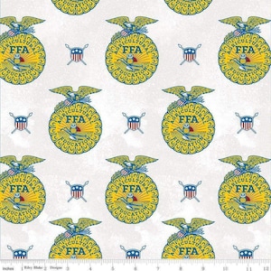 May include: A white fabric featuring a repeating pattern of the yellow and blue FFA Agricultural Education emblem, which includes an eagle, owl, and plow, interspersed with small red, white, and blue shield icons and a 12-inch ruler.