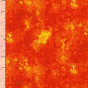 May include: A fabric swatch featuring a mottled, watercolor-style pattern in vibrant shades of orange, red, and yellow. A ruler along the left and bottom edges shows the fabric measures approximately 8 inches wide by 10 inches long.