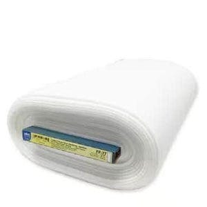 May include: A large, white, cylindrical roll of batting material featuring a blue and yellow cardboard label tucked into the center. The label displays the text FF-77 and additional printed information regarding the product specifications.