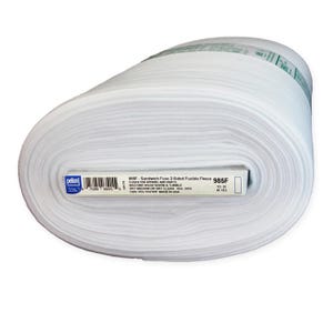 May include: A large roll of white Pellon 985F Sandwich Fuse 2-Sided Fusible Fleece. The label indicates it is 100% polyester, 45 inches wide, and 20 yards long. The text includes machine wash warm and tumble dry medium or dry clean instructions.