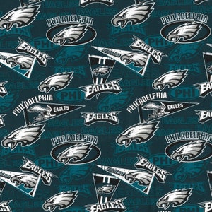 May include: A teal blue fabric with a repeating pattern of the Philadelphia Eagles logo. The logo features a white eagle head with a black beak and eyes, and the words "Philadelphia Eagles" in white text. The logo is surrounded by a white circle with a black outline. The fabric also features the words "Eagles" and "PHI" in white text.