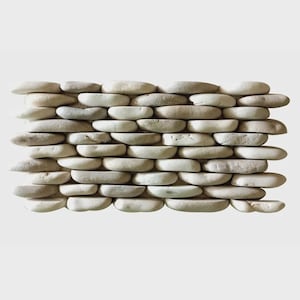 May include: A rectangular wall section constructed from smooth, light-colored river stones. The stones are stacked horizontally in a staggered pattern, creating a textured surface. The stones vary in size and shape, with a mix of beige, gray, and off-white hues.