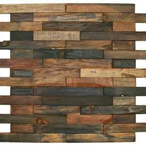 May include: A wall panel made of reclaimed wood with a rustic look. The panel is made up of various sized pieces of wood in shades of brown, gray, and black.