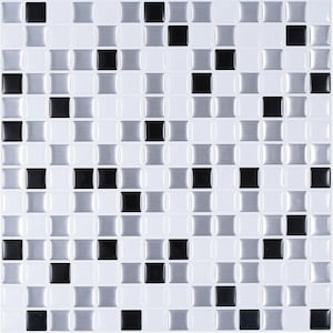 May include: A square mosaic tile pattern featuring a repeating grid of small, square tiles. The tiles are in a mix of white, black, and silver, creating a textured, geometric design. The tiles are slightly raised, giving a 3D effect.