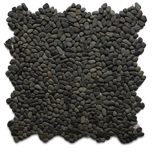 May include: A close-up of a black pebble mosaic tile. The tile is made up of small, round pebbles that are arranged in a random pattern. The pebbles are all about the same size and are a dark gray color.