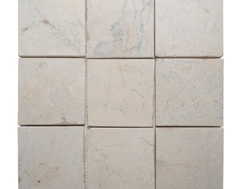 One piece of 4&quot; x 4&quot; Natural cream stone mosaic tile on a 12&quot;x 12&quot; mesh sheet for use on walls, floors, and other surfaces.