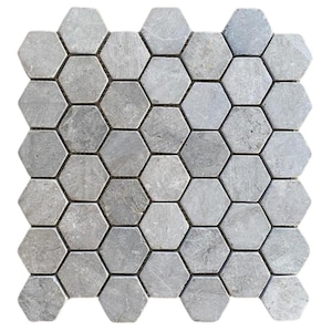 May include: A mosaic tile sheet composed of numerous gray, hexagonal tiles. The tiles have a natural stone appearance with variations in color and texture. The arrangement creates a geometric pattern suitable for various design applications.