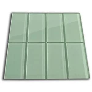 May include: A square of eight light green glass tiles arranged in two rows of four. Each tile is rectangular with a glossy finish. The tiles are set against a white background, with shadows suggesting a slight elevation.