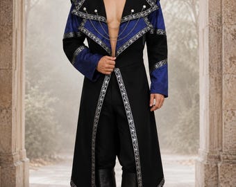 May include: A long black and blue coat featuring wide lapels, silver embroidery, and a decorative silver chain closure. The coat is worn over black trousers and black knee-high boots, creating a structured, layered appearance with pointed shoulders.