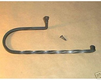 May include: A black wrought iron paper towel holder with a twisted bar design. The holder has a curved arm and a mounting bracket. A screw is included for installation. The paper towel holder is designed to be mounted on a wall.