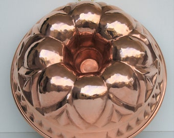 Copper mold for sweets and food. Round shape with relief design