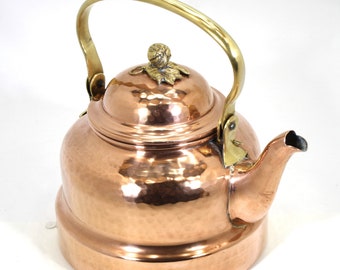 Vintage handcrafted copper teapot with brass handle