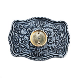 May include: A silver-toned belt buckle with an ornate floral design and a gold-toned center piece.