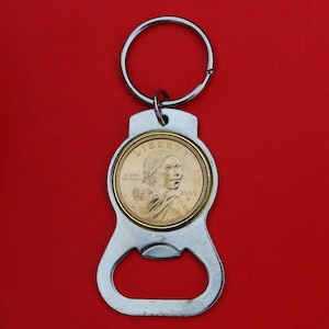 US 2000 ~ 2008 Sacagawea Dollar BU Unc Coin Silver Tone Key Chain Ring Bottle Opener - Sacagawea and Her Infant Son Obverse