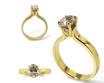 Diamond .93ct golden brown, centre stone comes with a IGI report. Two small diamonds on side of setting. 18k solid yellow gold, 7mm high