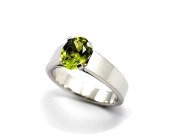 Snow 9K solid gold Peridot 9mmx7mm around 2ct ,Snow Whites ring beautifilly hand made in yellow or white gold (size 61/2 in 9kw 7gm of gold)