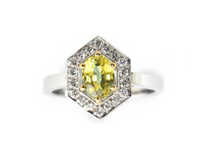 Yellow Sapphire 1.90ct,diamonds 25pt,18k white gold (sold),featuring a unique yellow petitioned Sapphire. Price includes shipping insurance.