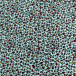 May include: A fabric with a repeating leopard print pattern. The spots are in a variety of colors, including red, yellow, blue, and purple, against a light blue background. The fabric has a soft, textured appearance.