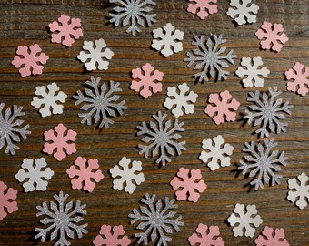 Rosa, vit och silver snöflingkonfetti för vinterfest