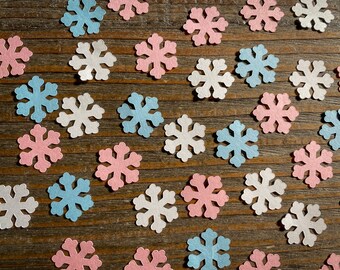Rosa, blå och vit snöflinga för könsavslöjande eller babyshowerkonfetti