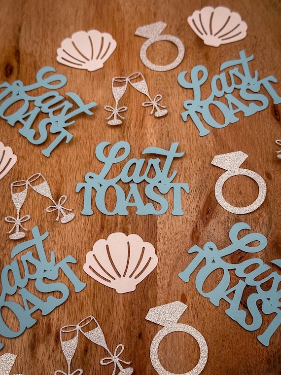 Last Toast on the Coast Confetti with Silver Engagement Rings